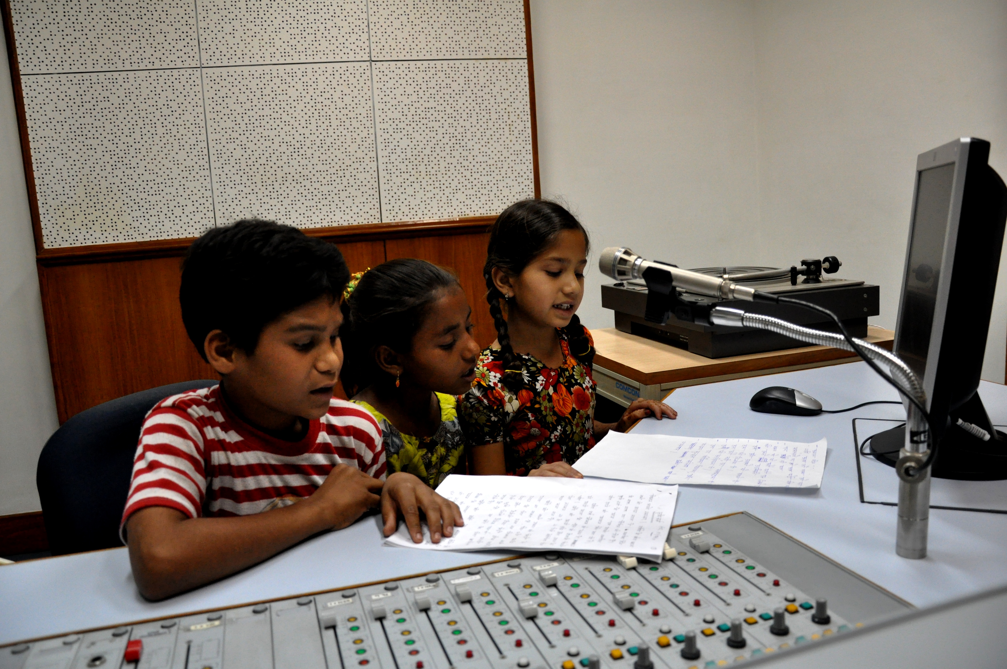 Radio kid. Children with a Radio. Children's Day of International Television and Radio Broadcasting.